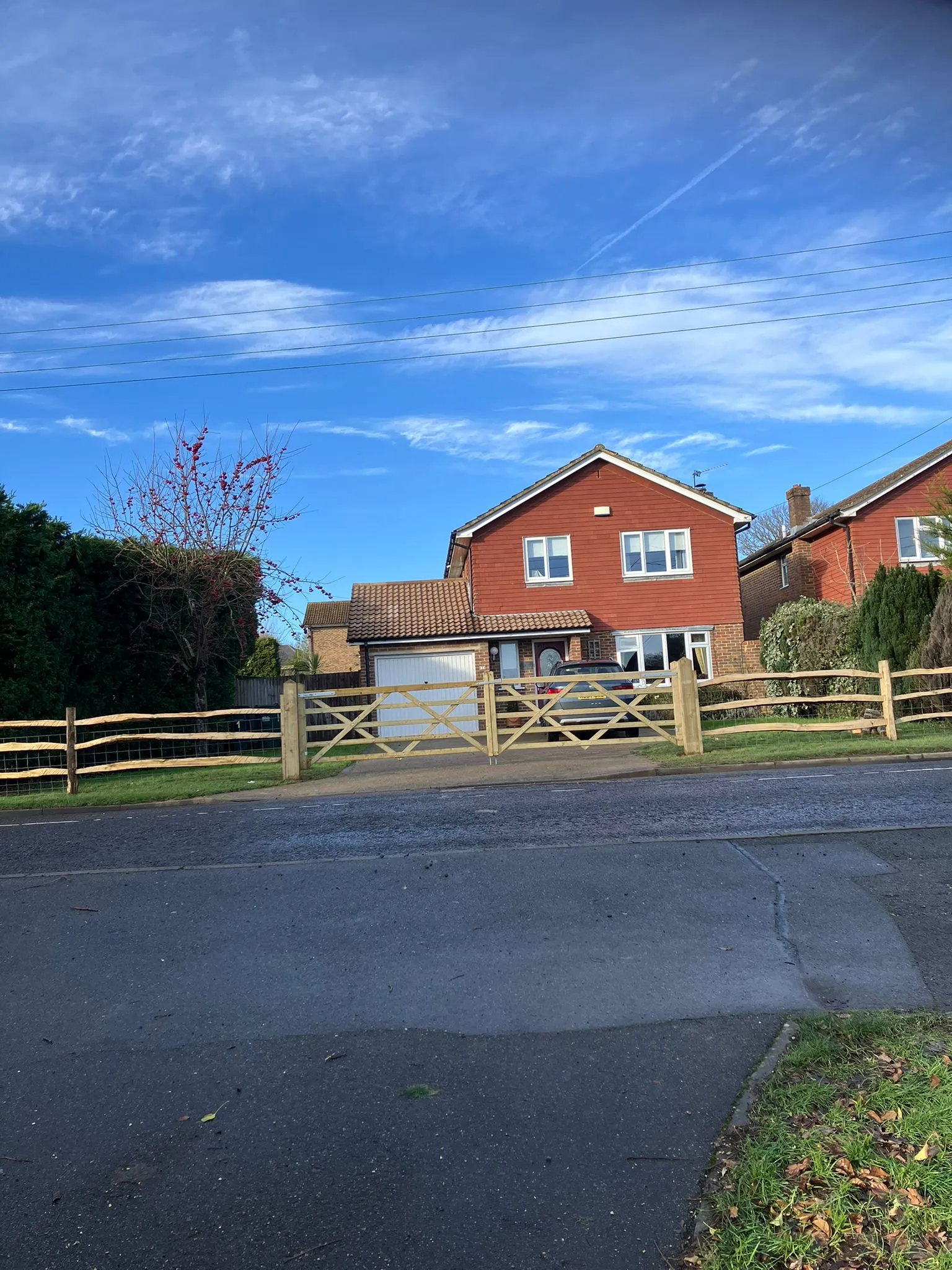 A photo from the A new post-and-rail front fence with a five-bar gate. case study in Northiam.