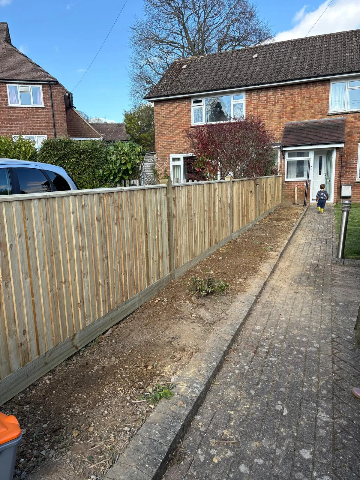 A photo from the A close-board side fence rebuilt. case study in Hurst green .
